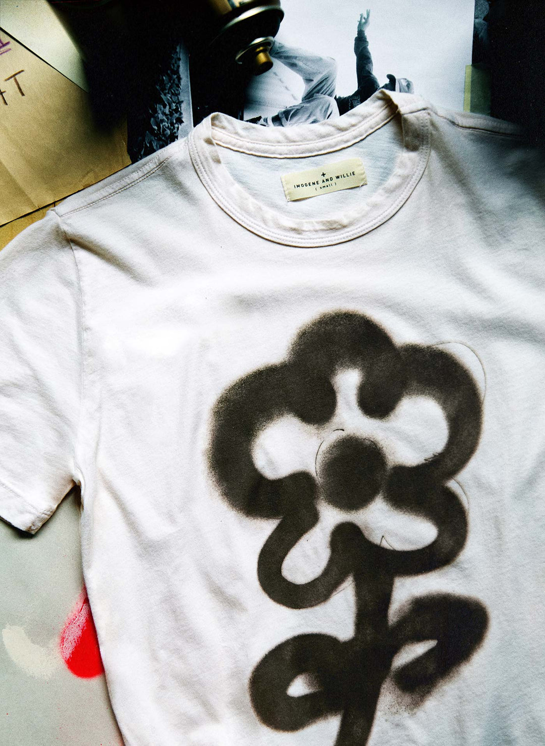 a white shirt with a flower design on it