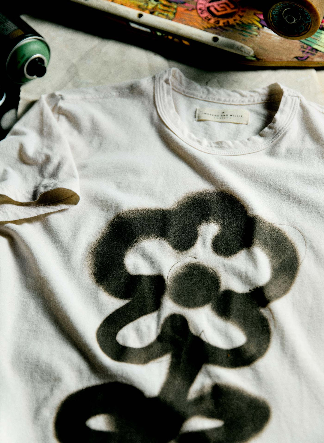 a white shirt with a black design on it