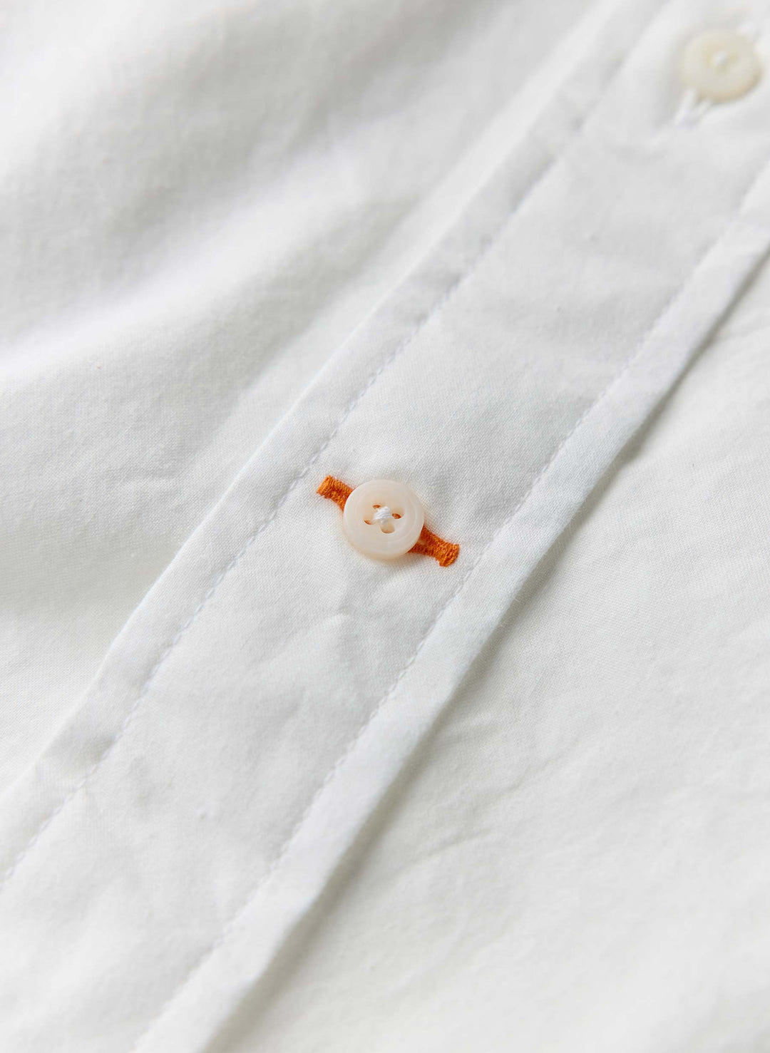 a button on a white shirt