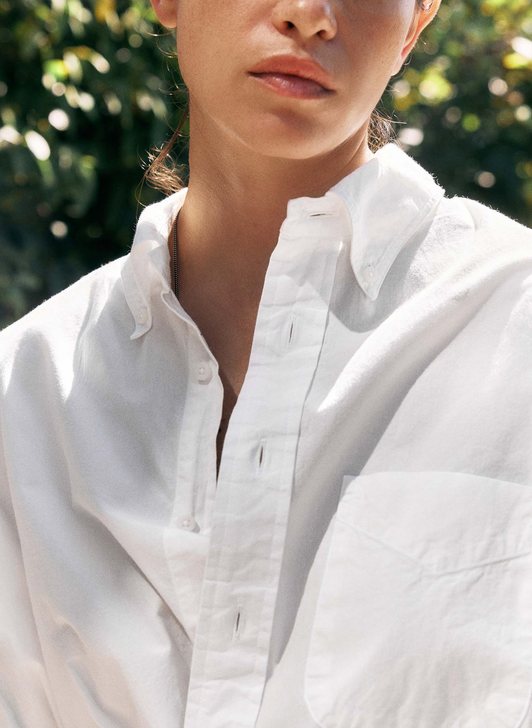 a woman wearing a white shirt