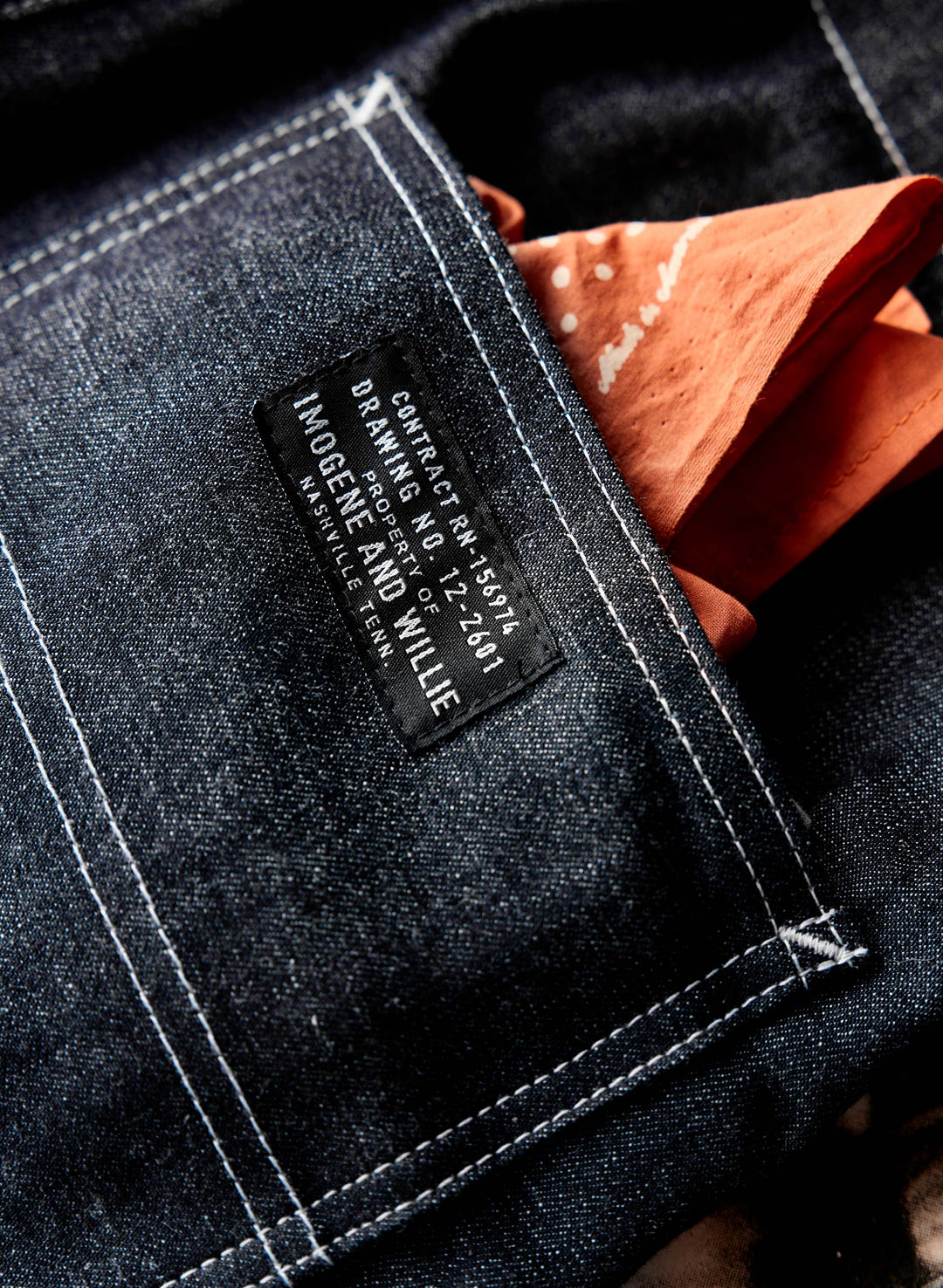 a pocket with a tag and a handkerchief