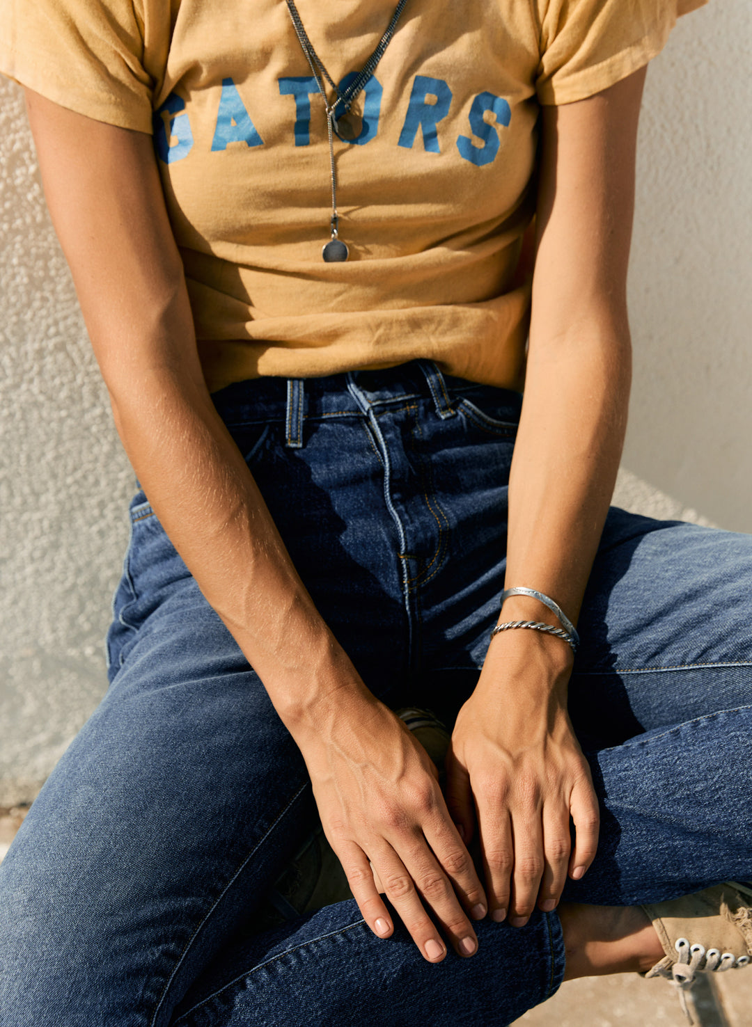 a person sitting on a rock