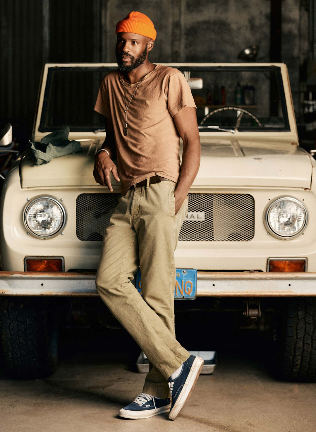 a man leaning on a car