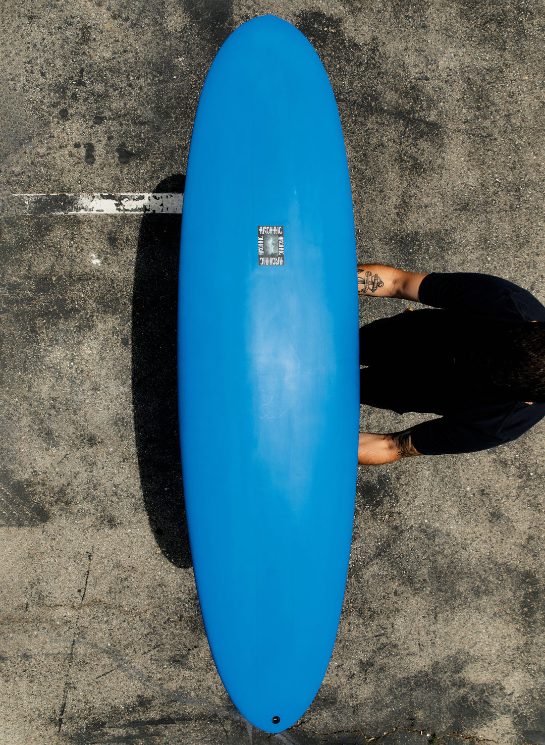 a person holding a blue surfboard