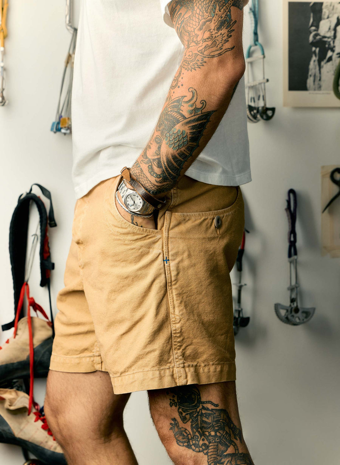 a man with tattoos on his arm