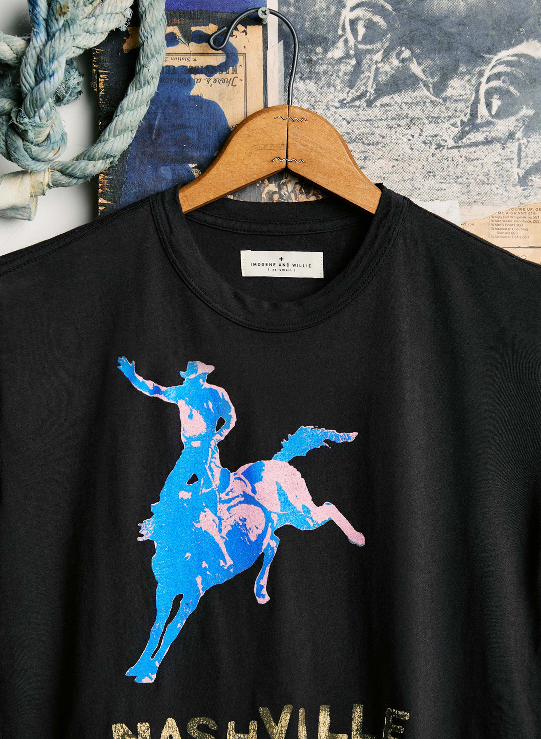 a black shirt with a blue and pink graphic on it