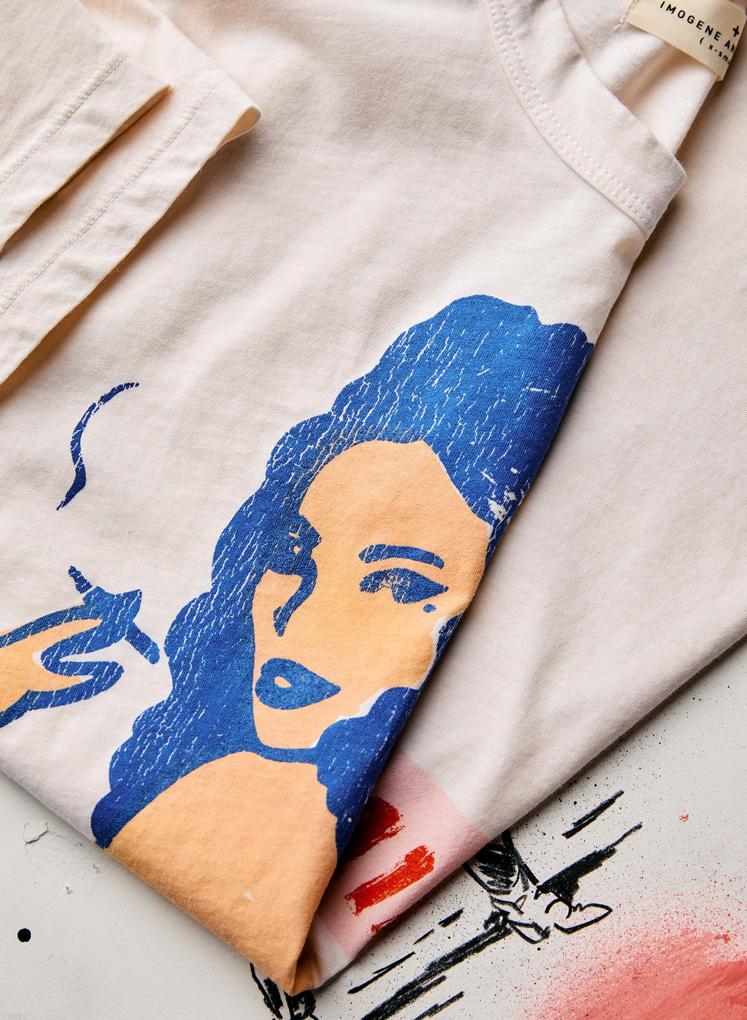 a t-shirt with a drawing of a woman smoking a cigarette