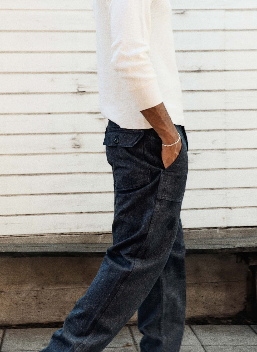 a man in a white shirt and blue jeans