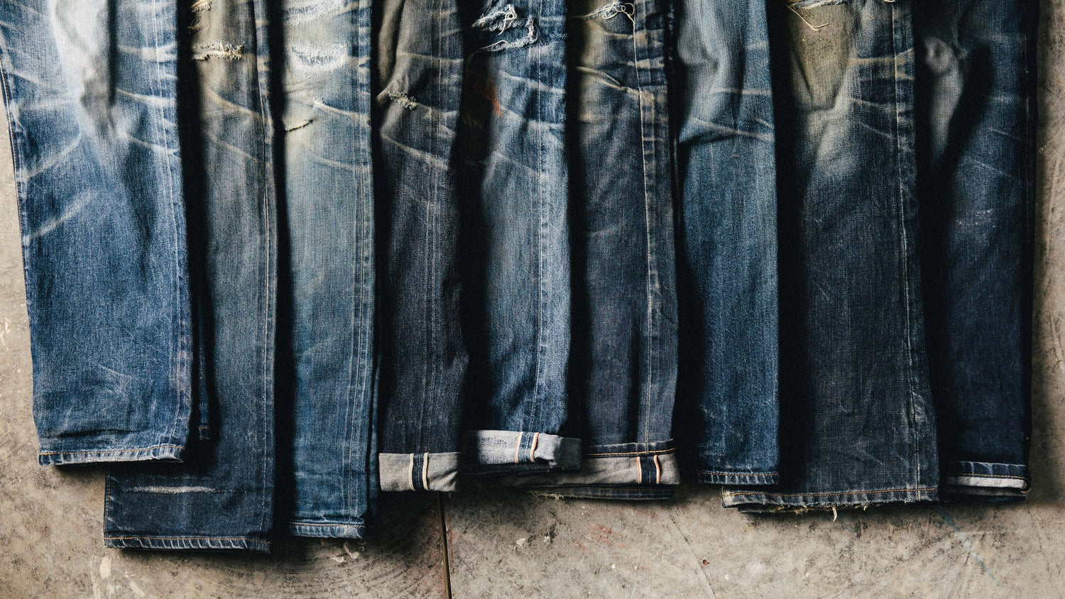 a row of jeans folded in rows