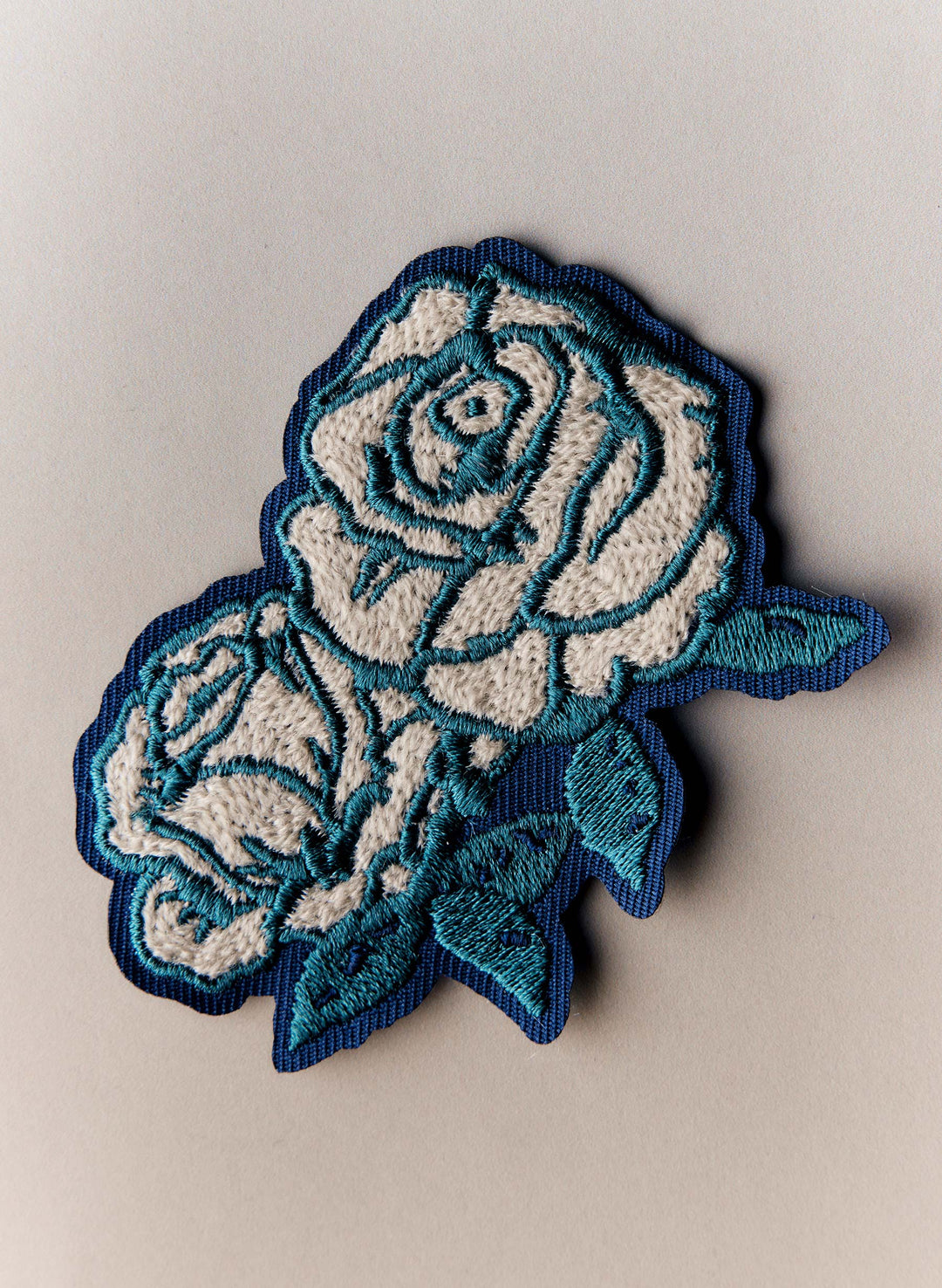 a blue and white embroidered flower