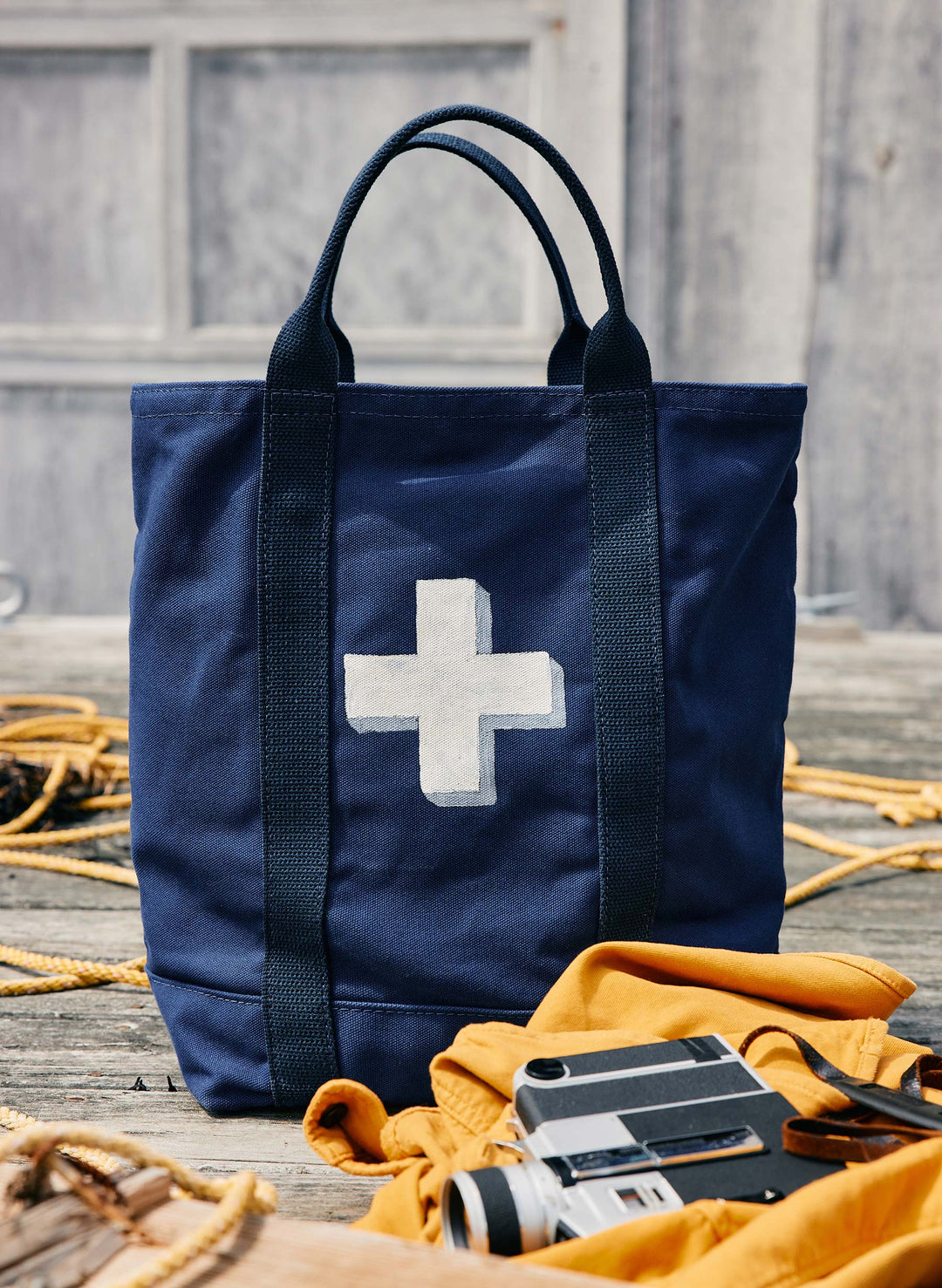 a blue and white bag with a white cross on it