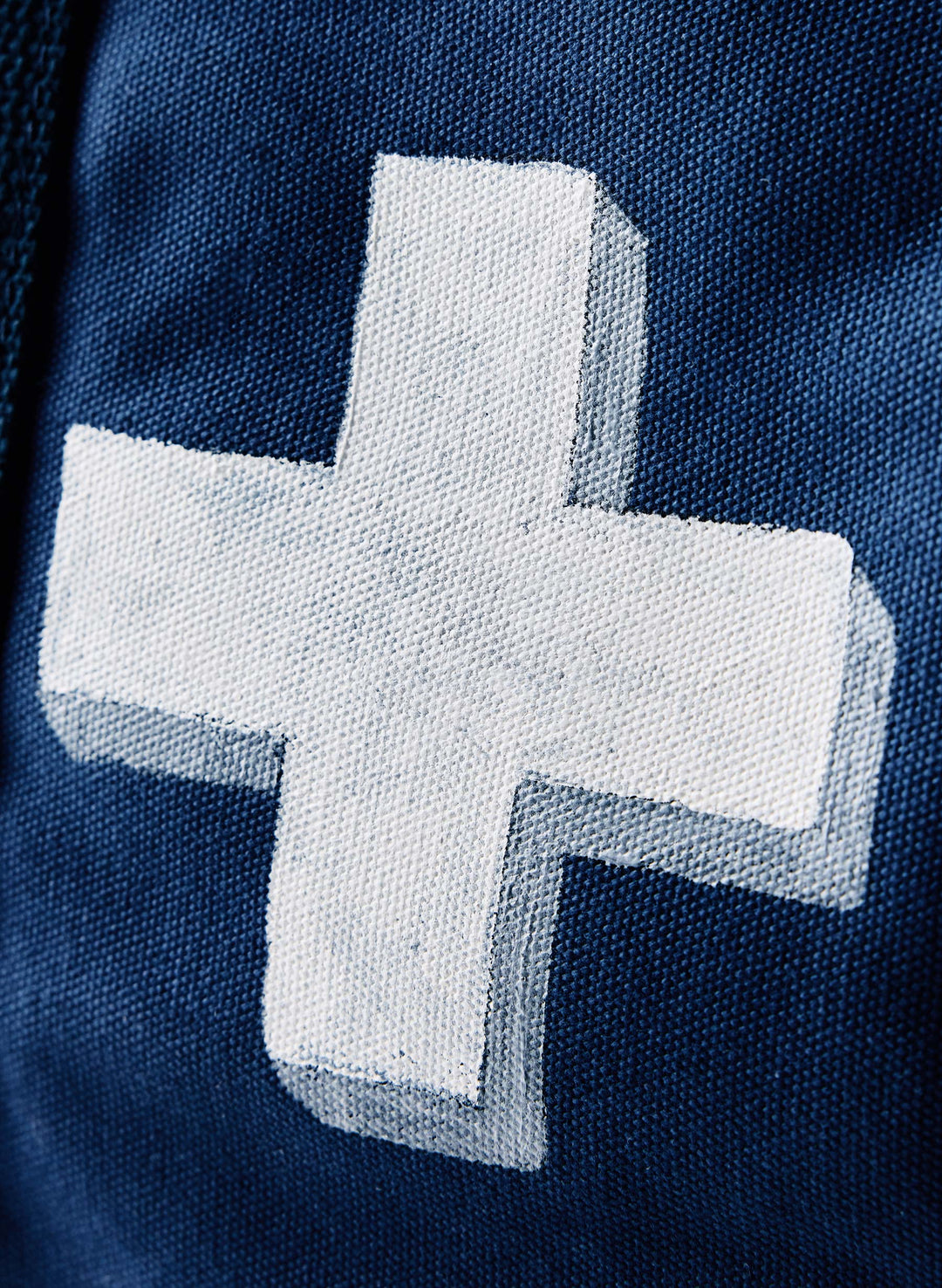 a white cross on a blue fabric