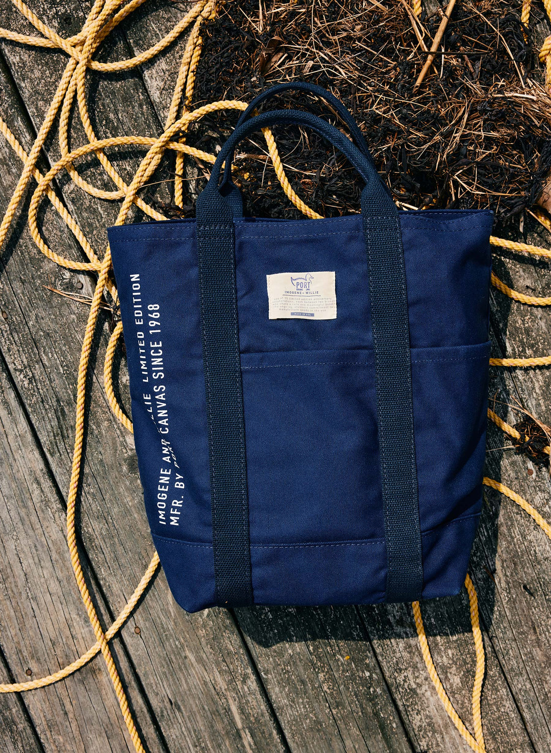 a blue bag on a wood surface