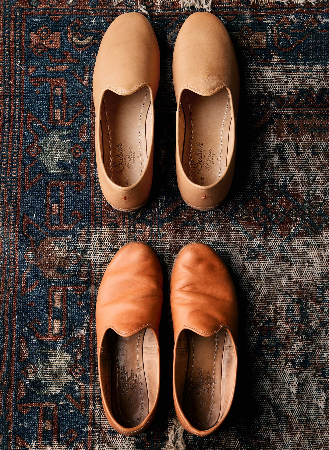 a pair of shoes on a rug