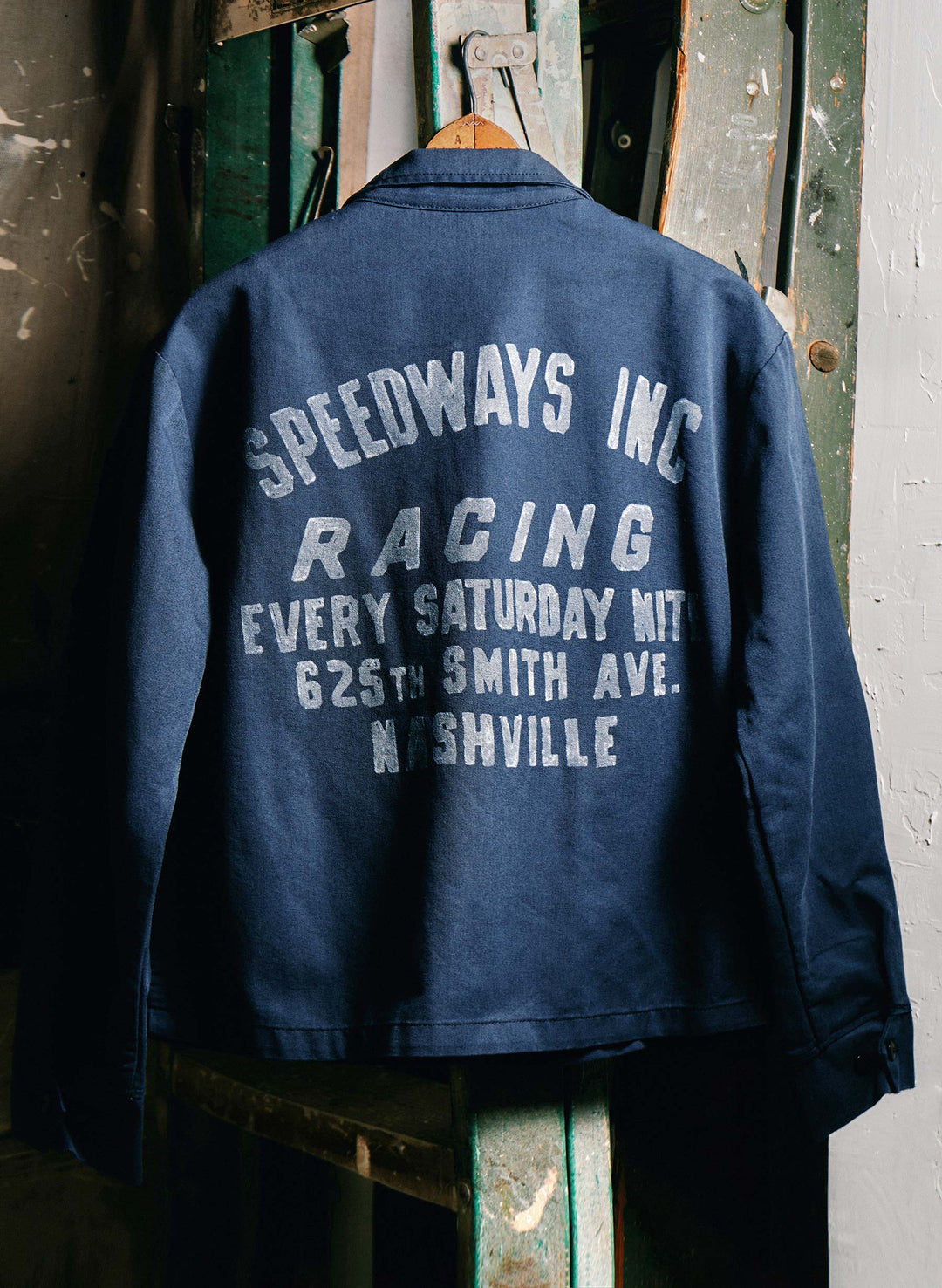 a blue jacket with white text on it