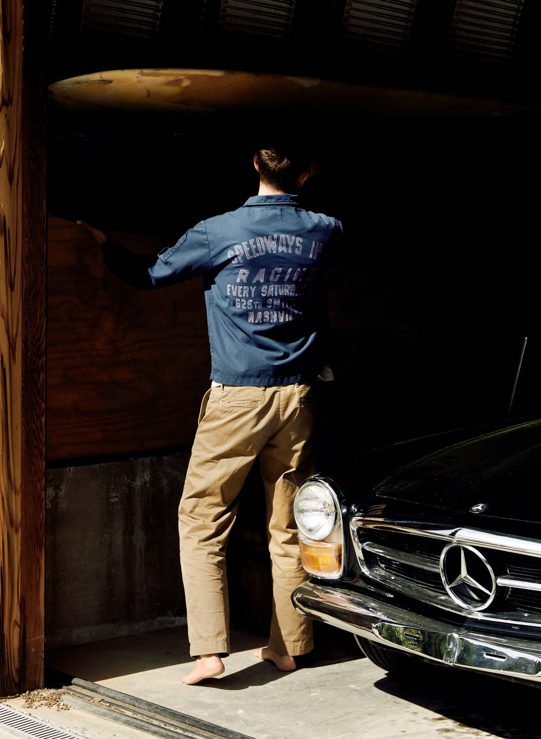 a man standing in a garage