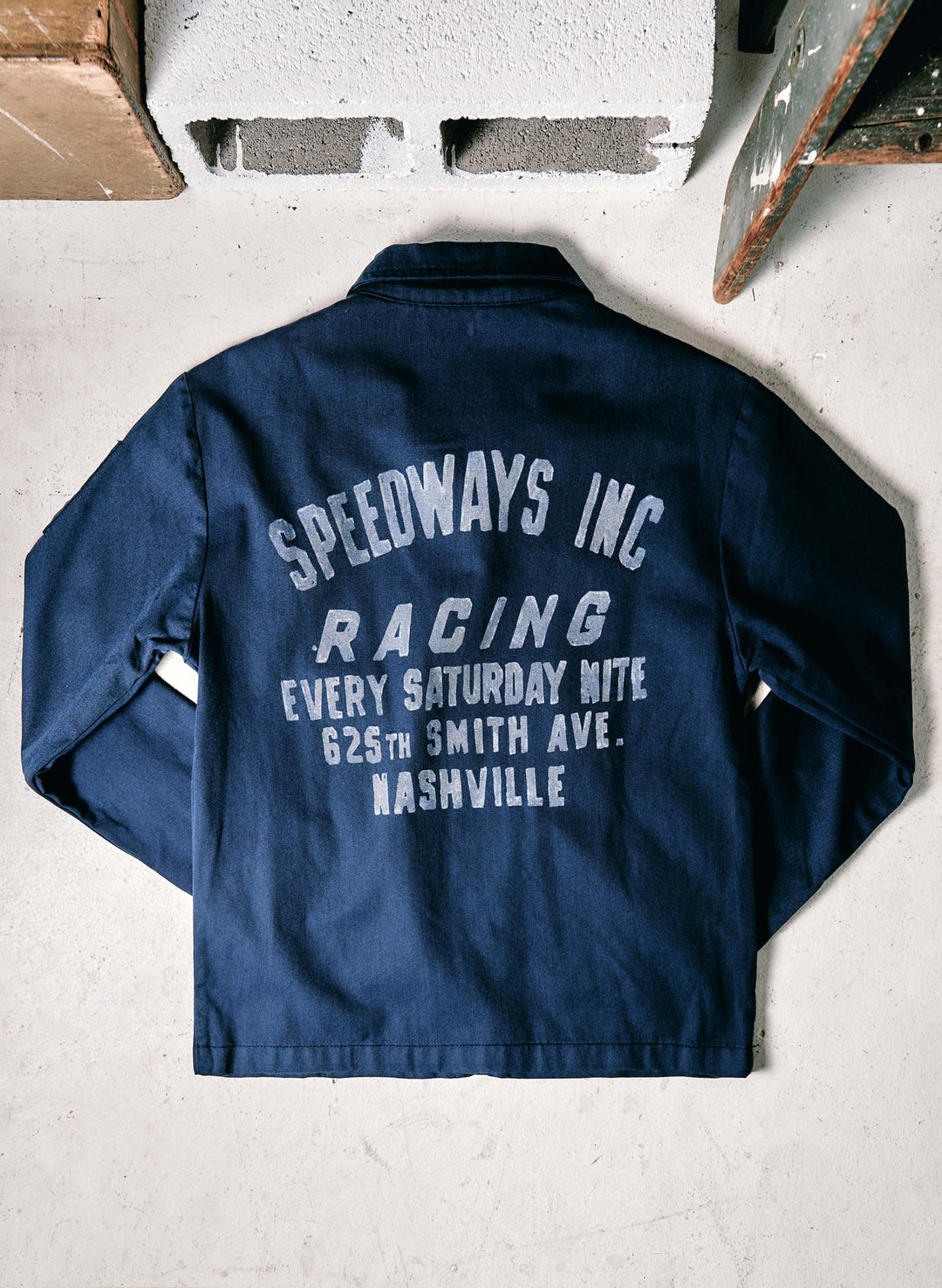 a blue jacket with white text on it
