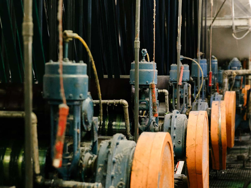 a group of blue machines with orange and blue pipes