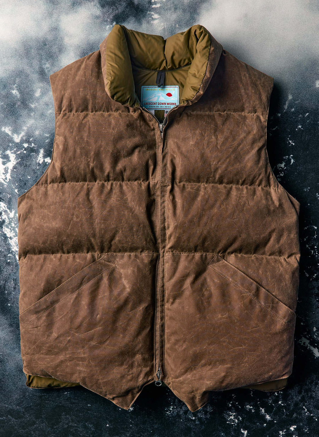 a brown vest on a grey surface