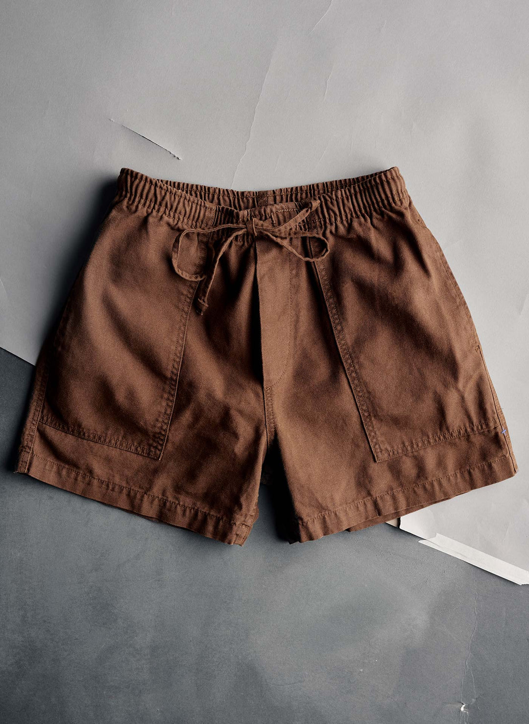 a brown shorts on a gray and white surface