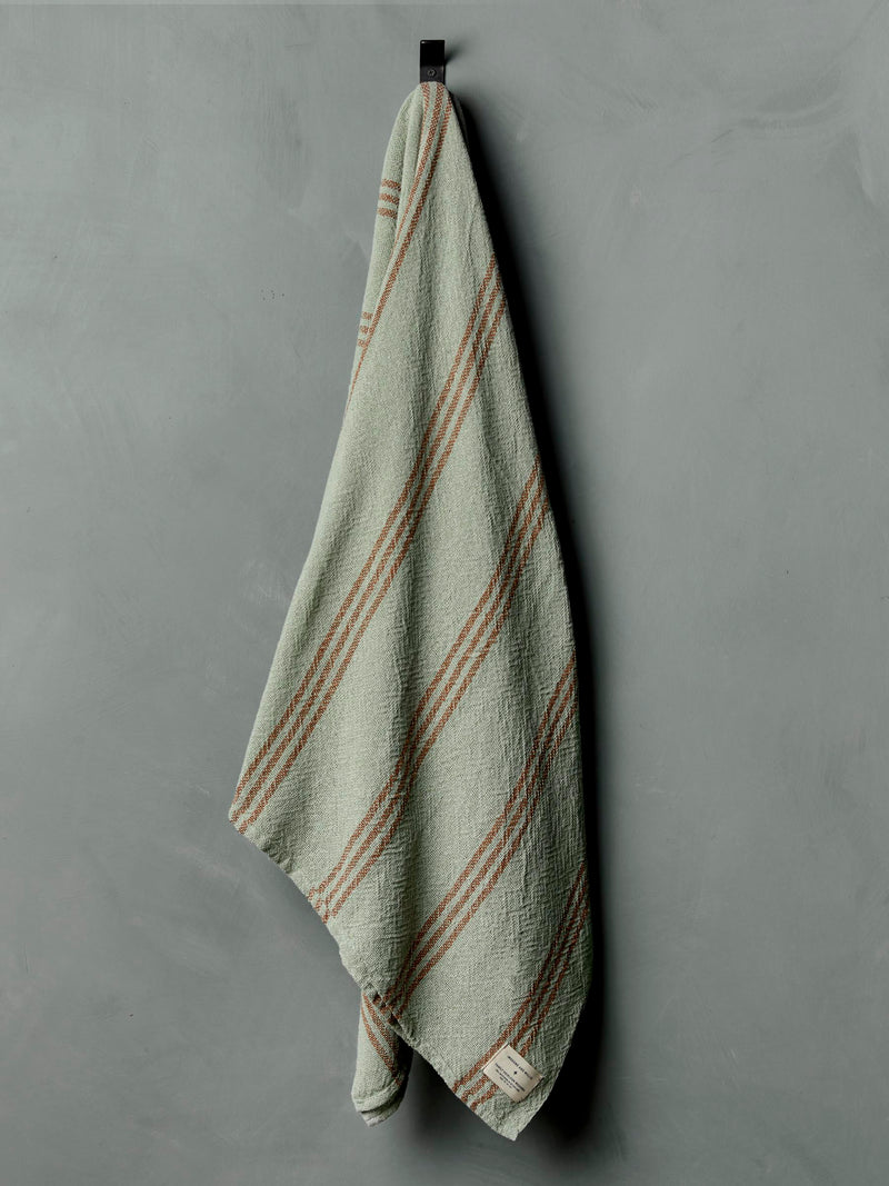 i+w x family heirloom weavers cotton throw in sage stripe - Model