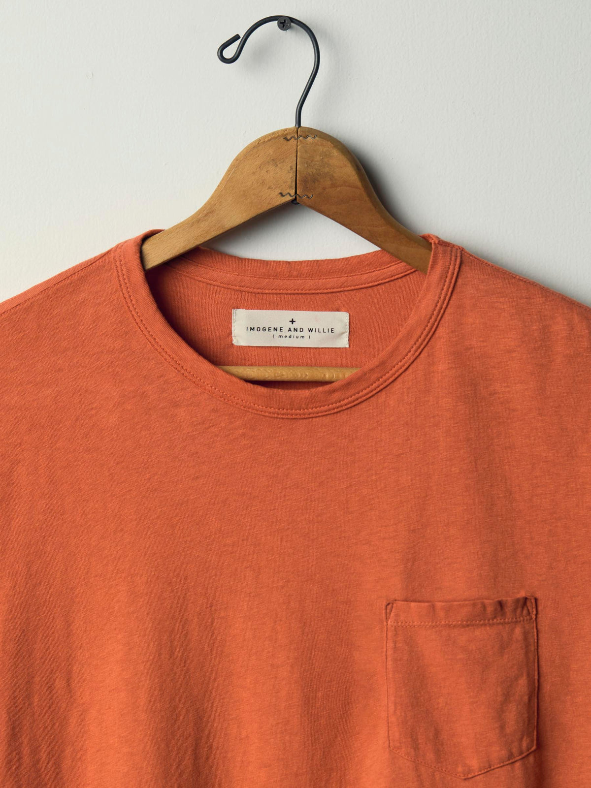 faded orange knit pocket tee