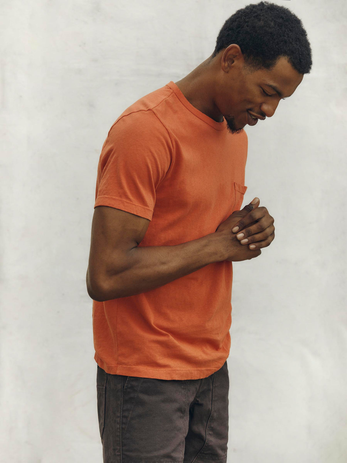 faded orange knit pocket tee