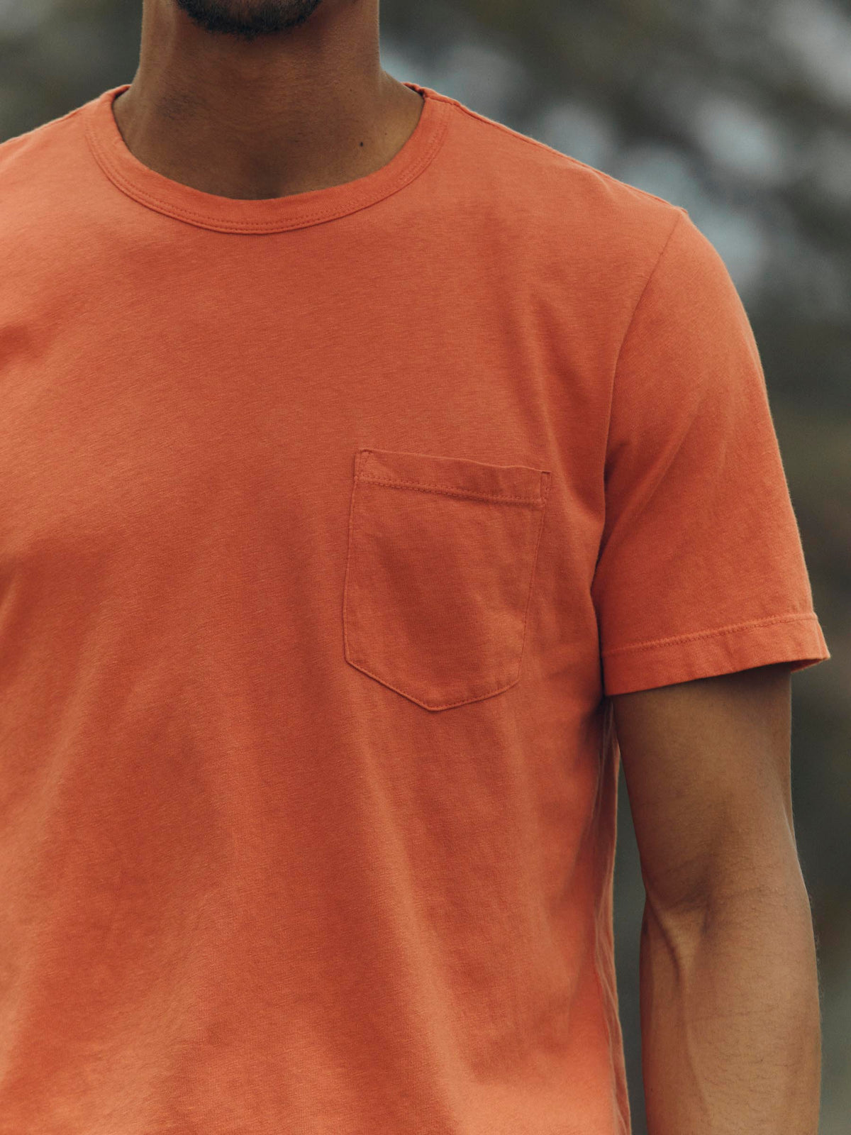 faded orange knit pocket tee