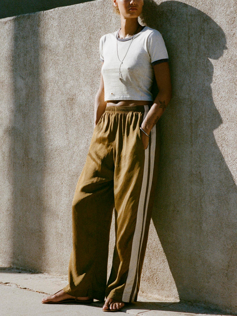 striped track pant in gold - Model