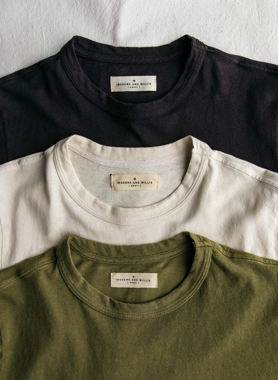 a group of shirts with a label