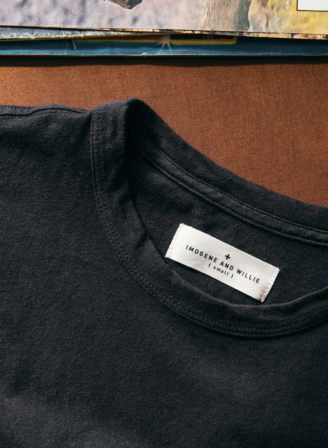 a black shirt with a white label