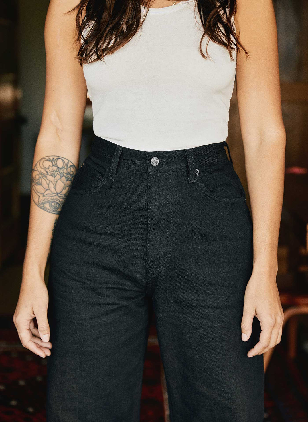 a woman wearing black jeans