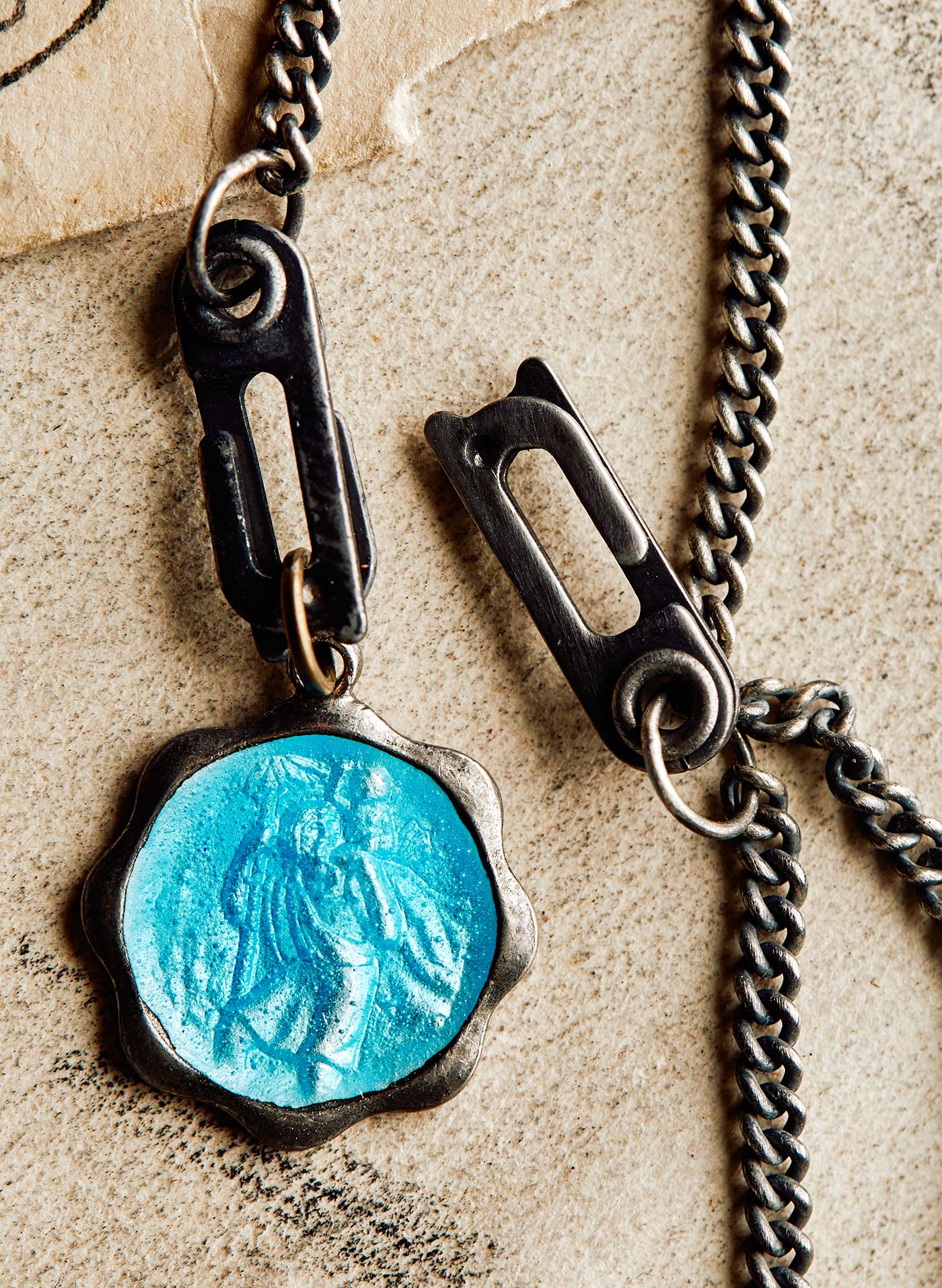 Body jewelry, Aqua, Material property, Font, Creative arts, Necklace, Natural material, Jewellery, Electric blue, Metal