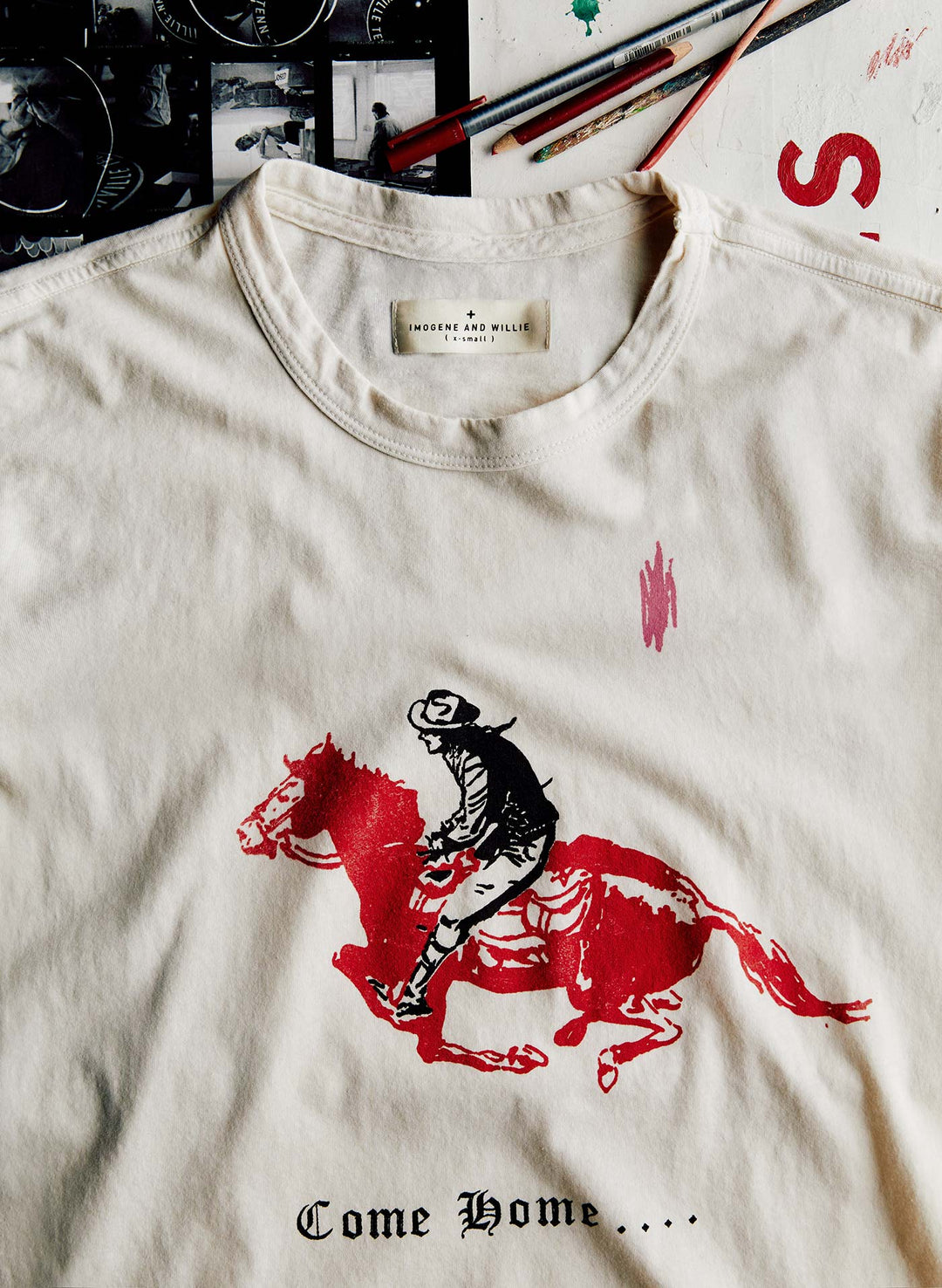 a white t-shirt with a cowboy on it