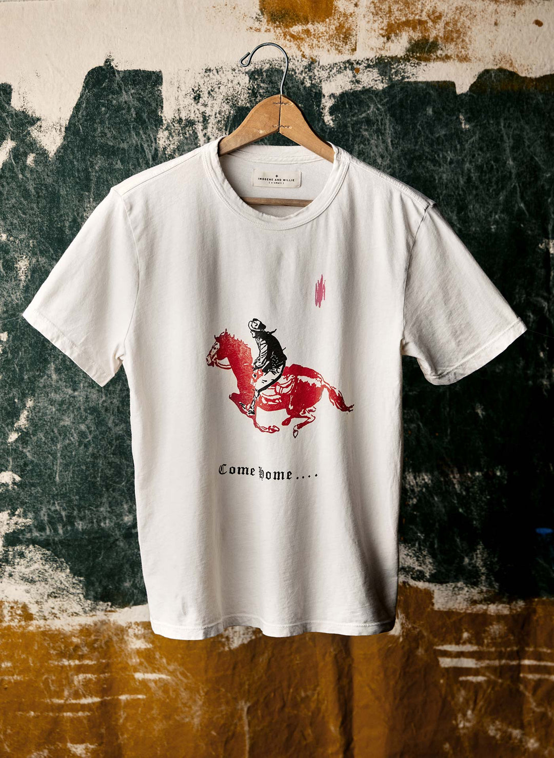 a white t-shirt with a horse on it