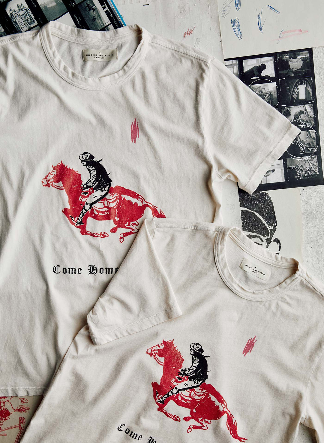 a couple of white shirts with red and black images