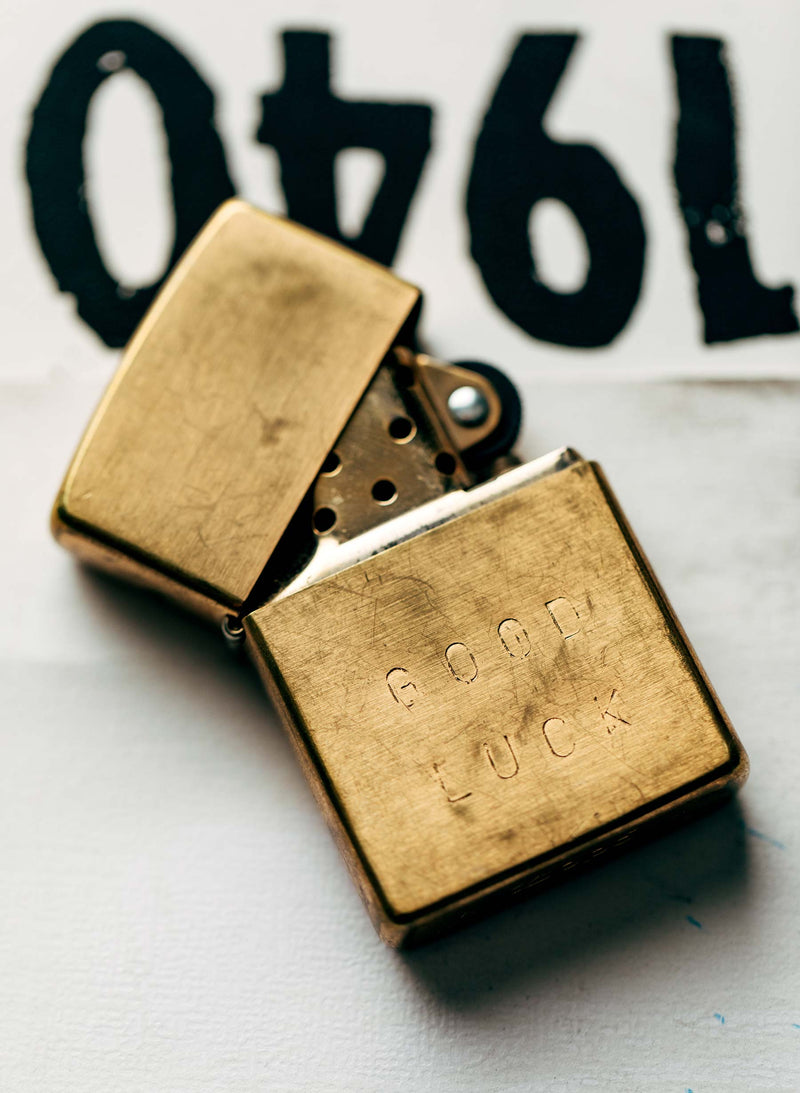 hand stamped "good luck" zippo