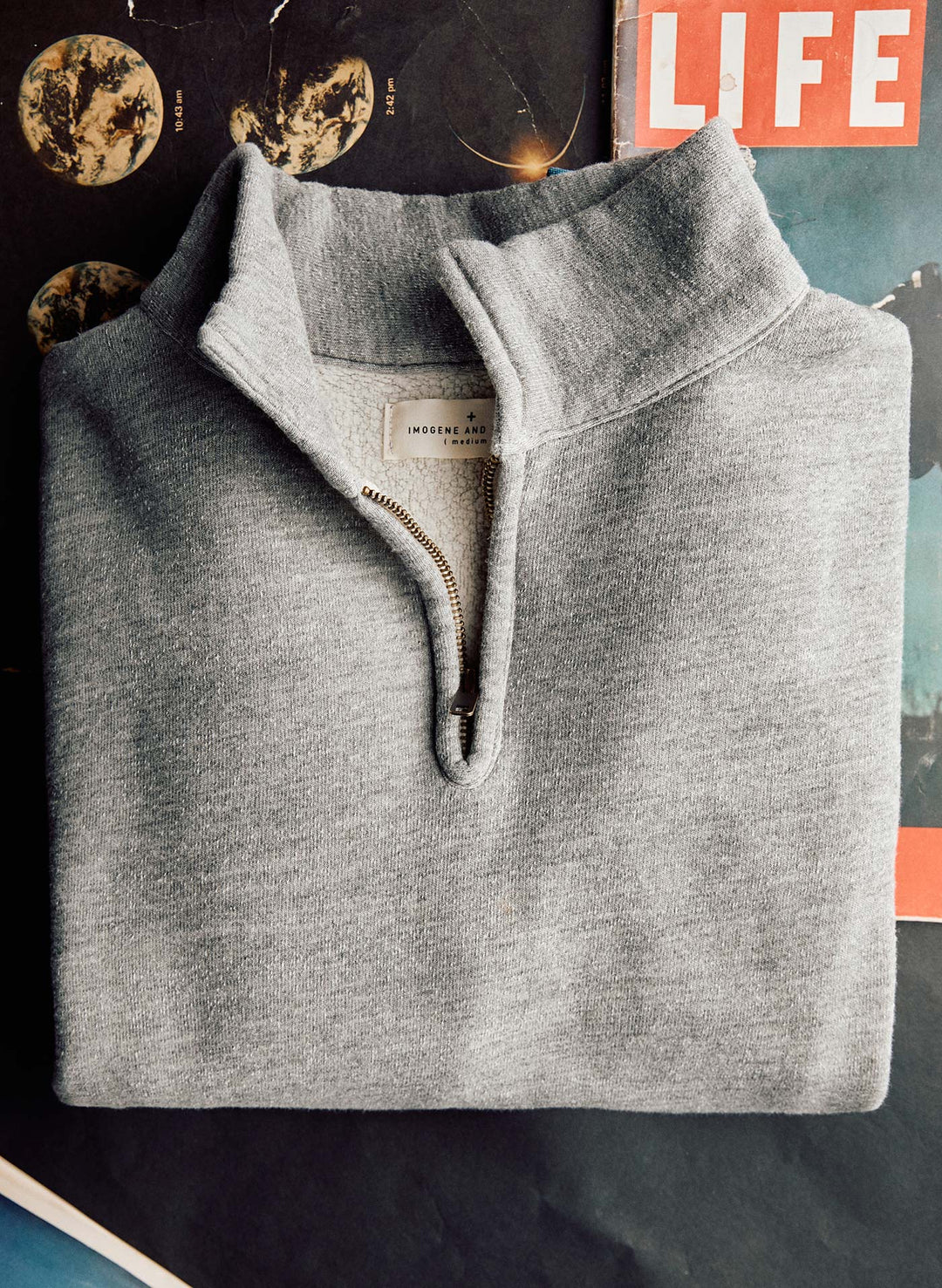 a grey sweater on a table