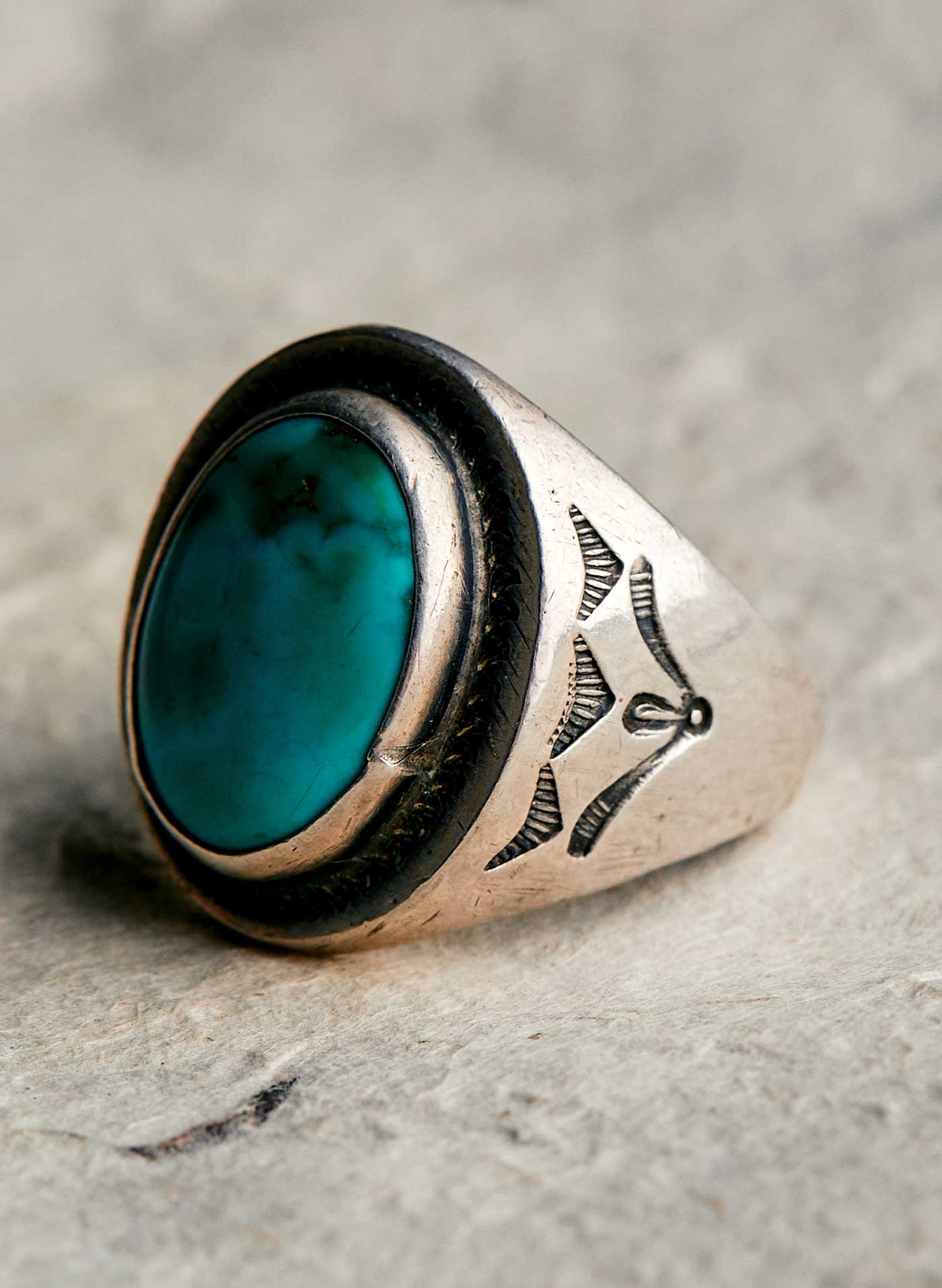 Body jewelry, Natural material, Wood, Oval, Jewellery, Electric blue, Circle, Close-up, Font, Ring